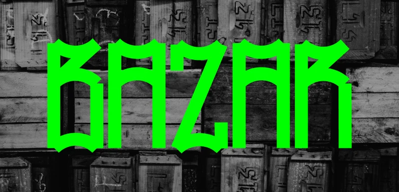 A palavra BAZAR em verde neon, composta com a fonte Mosquito sobre fotografia em preto e branco de caixotes de madeira.